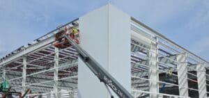 boeing new building under construction by lightgauge co with staff working on the framing of the building