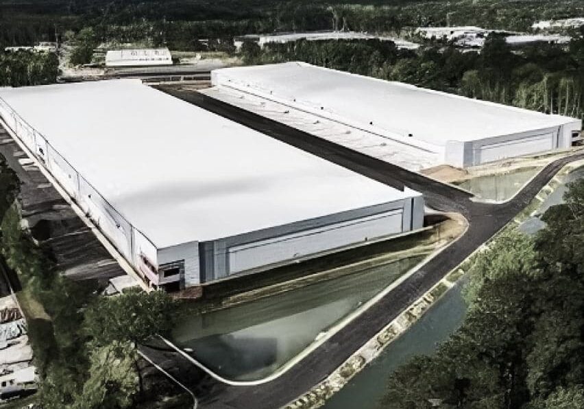 two large industrial buildings after construction was completed